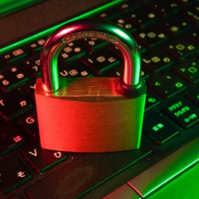 cyber security padlock sat on keyboard