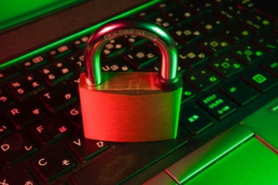 cyber security padlock sat on keyboard